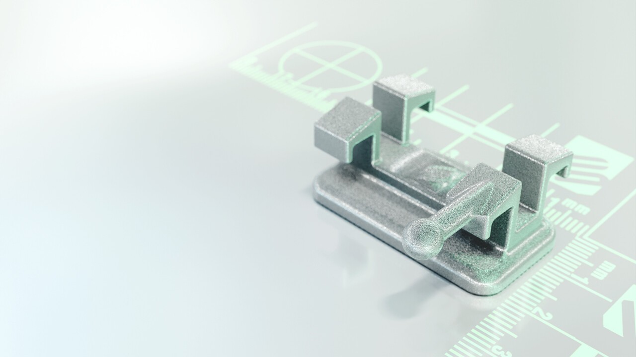 Ein Dental-Bracket, nur wenige mm groß. 20 unterschiedliche Brackets sind nötig, um ein Set ("Brace") herzustellen. Mit herkömmlichen Fertigungsmethoden sehr kostspielig, da 9 verschiedene Werkzeuge hierfür gefertigt werden müssen! Mit "LMM" können komplette Sets auf einmal gedruckt werden.