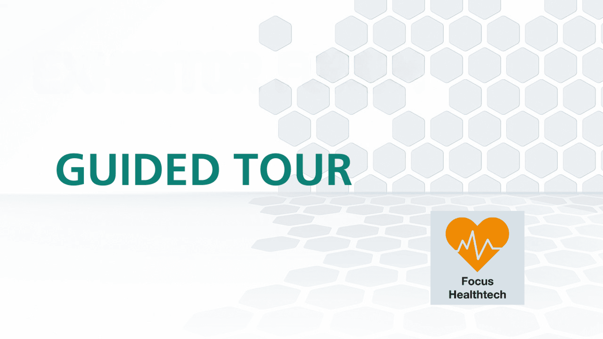 The text Guided Tour is on a white background with gray hexagon patterns. An orange heart with a heartbeat line and the words Focus Healthtech are visible in the lower right corner.