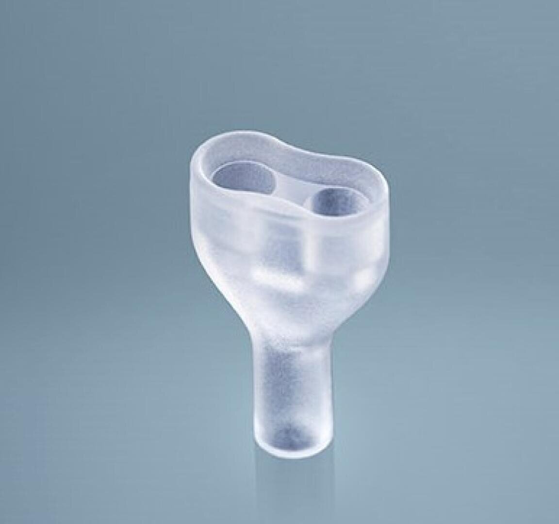 A transparent silicone medical device with two oval openings at the top and a single cylindrical stem at the bottom on a plain light blue background.
