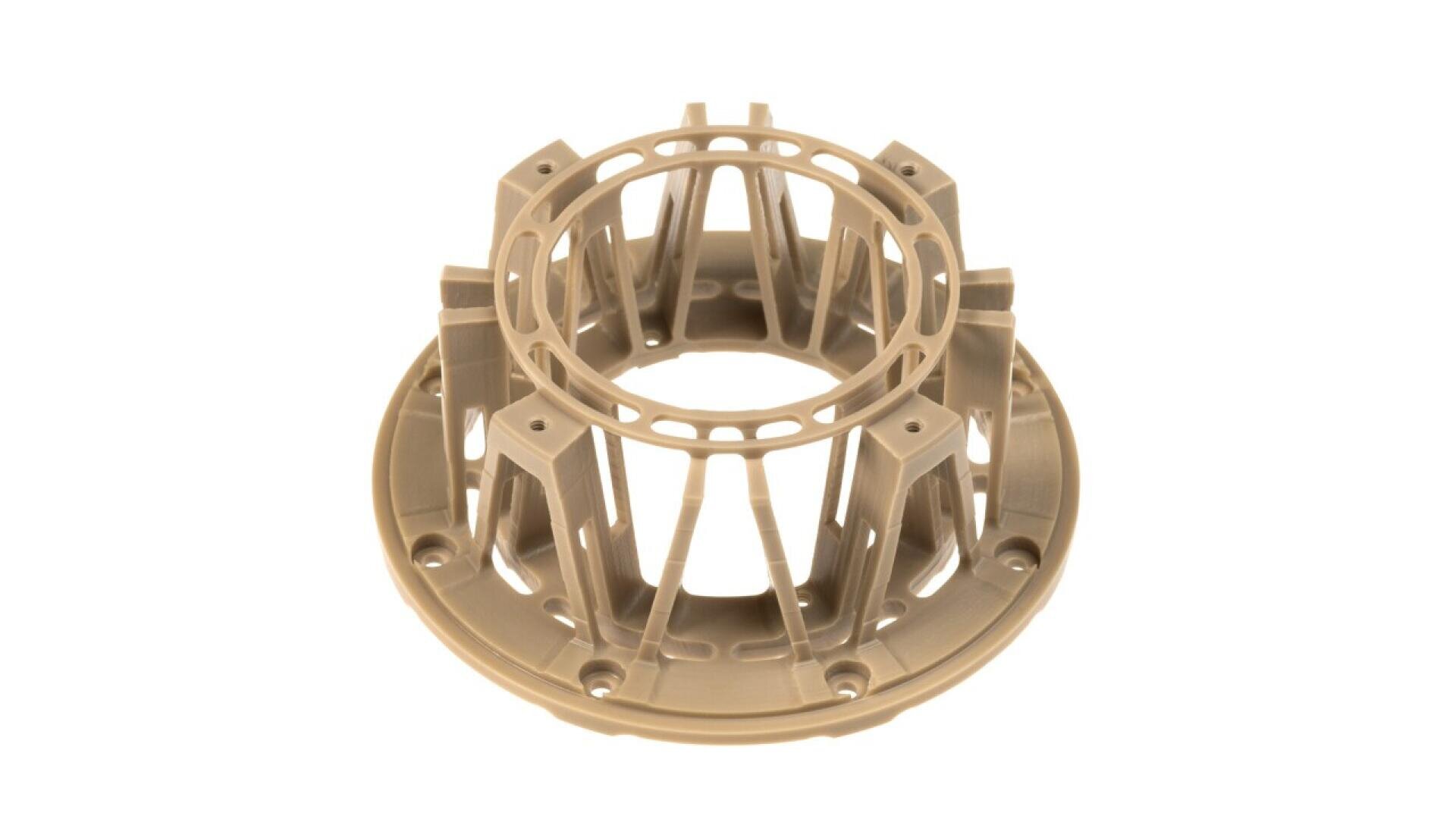 Beige, circular plastic component with radial supports and lattice detailing, featuring a central hollow opening and a wide, flanged base, likely used as a structural or mechanical part.