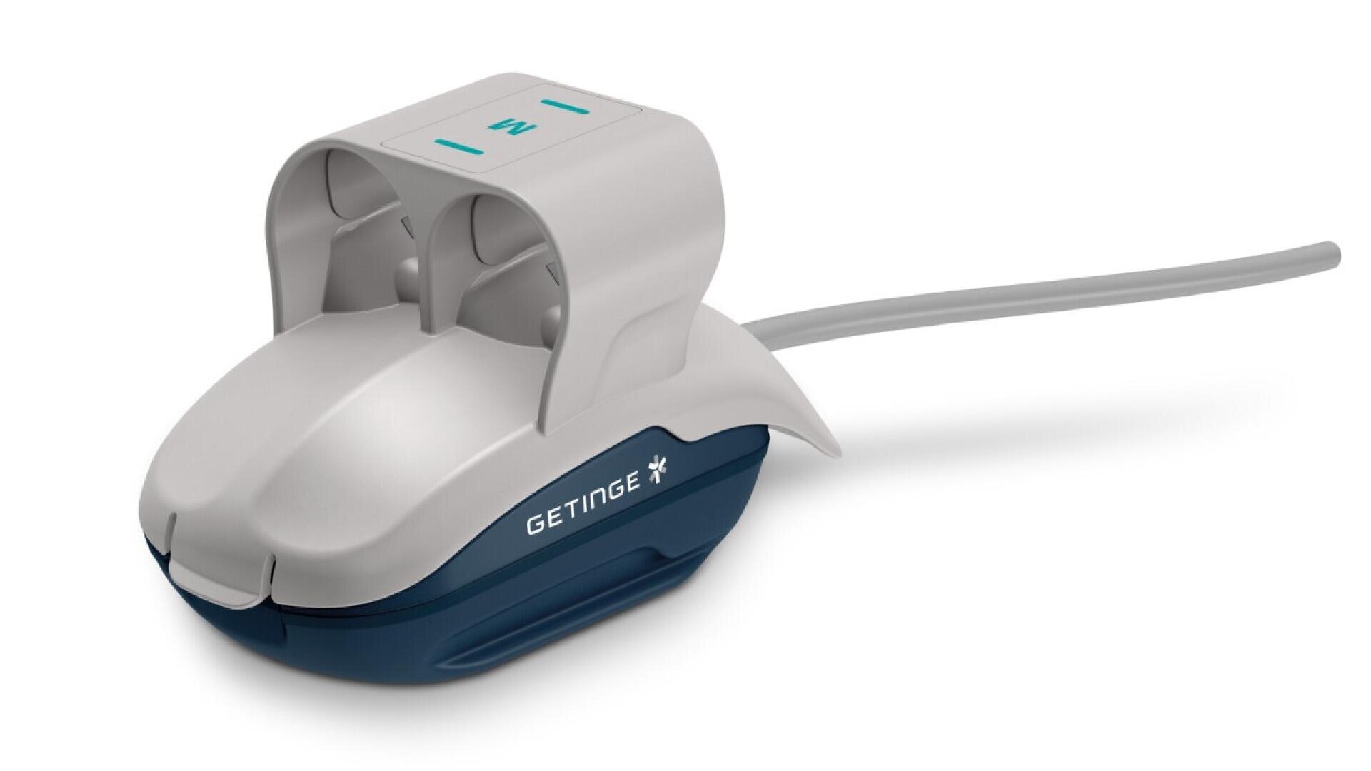 A white and blue medical device labeled GETINGE with a cord attached, featuring a curved body and a handle-like top section with two slots and teal icons.