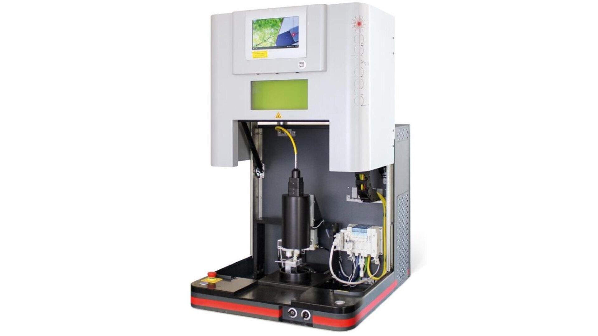A modern industrial laser marking machine with an open front, touchscreen interface, emergency stop button, and visible internal components and wiring.