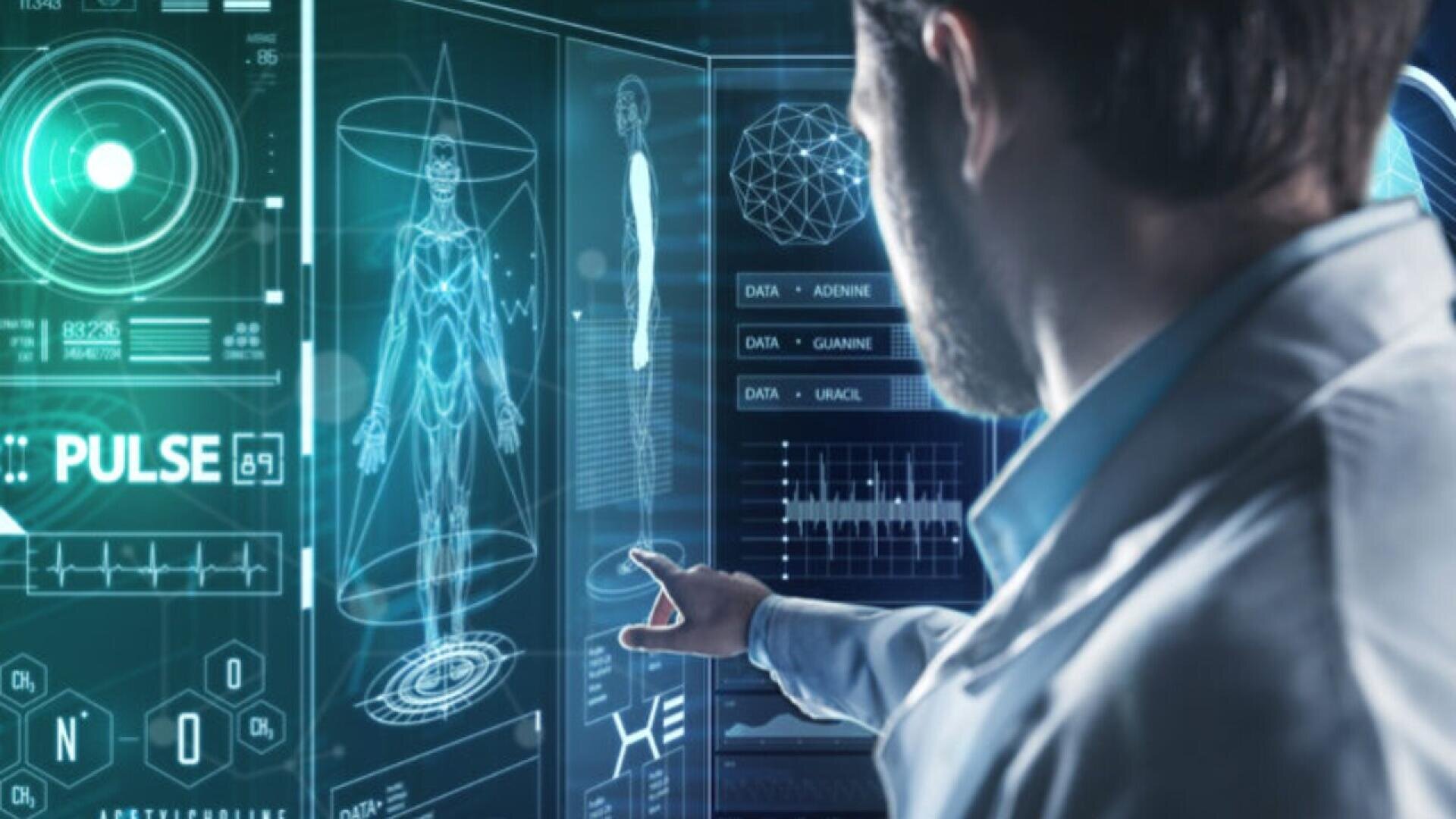 A person in a lab coat interacts with a large transparent screen displaying holographic medical data, including a digital human body, vital signs, and scientific charts in a futuristic setting.