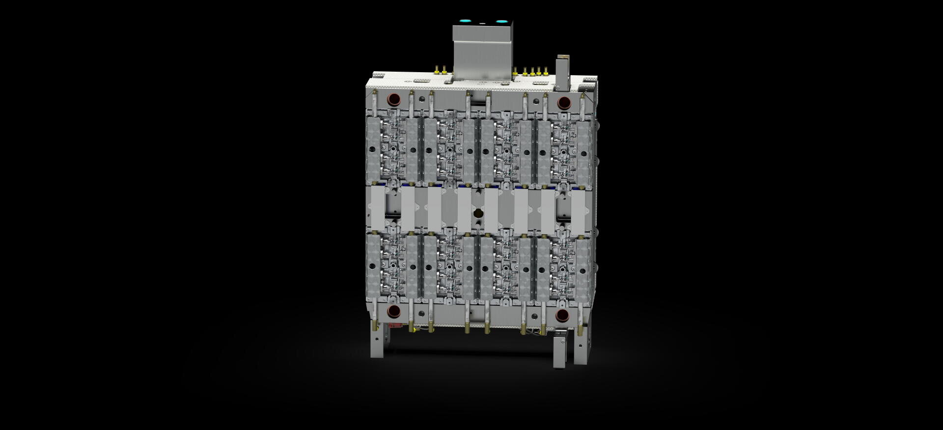 A metallic, rectangular industrial device with several vertical plates, connections and ports, standing on four short legs against a black background.