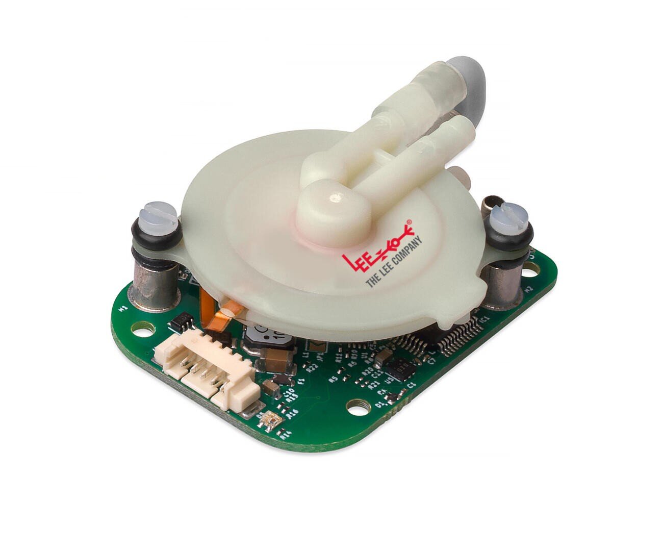 Nahaufnahme eines elektronischen Bauteils mit einer grünen Leiterplatte und einem runden, durchsichtigen Kunststoffteil auf der Oberseite, beschriftet mit The Lee Company, mit zwei Röhrenanschlüssen und verschiedenen elektronischen Elementen.