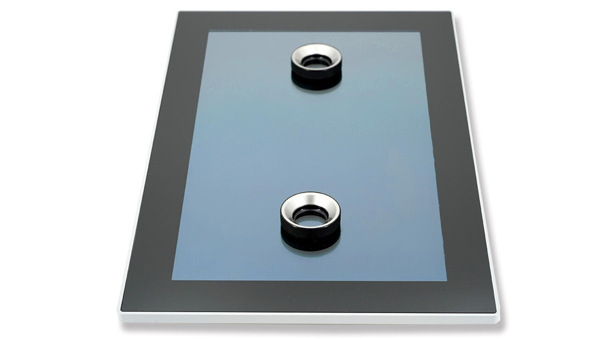 A rectangular black glass panel with two circular silver knobs positioned vertically in the center. The panel has a reflective surface and a black border around the edges.