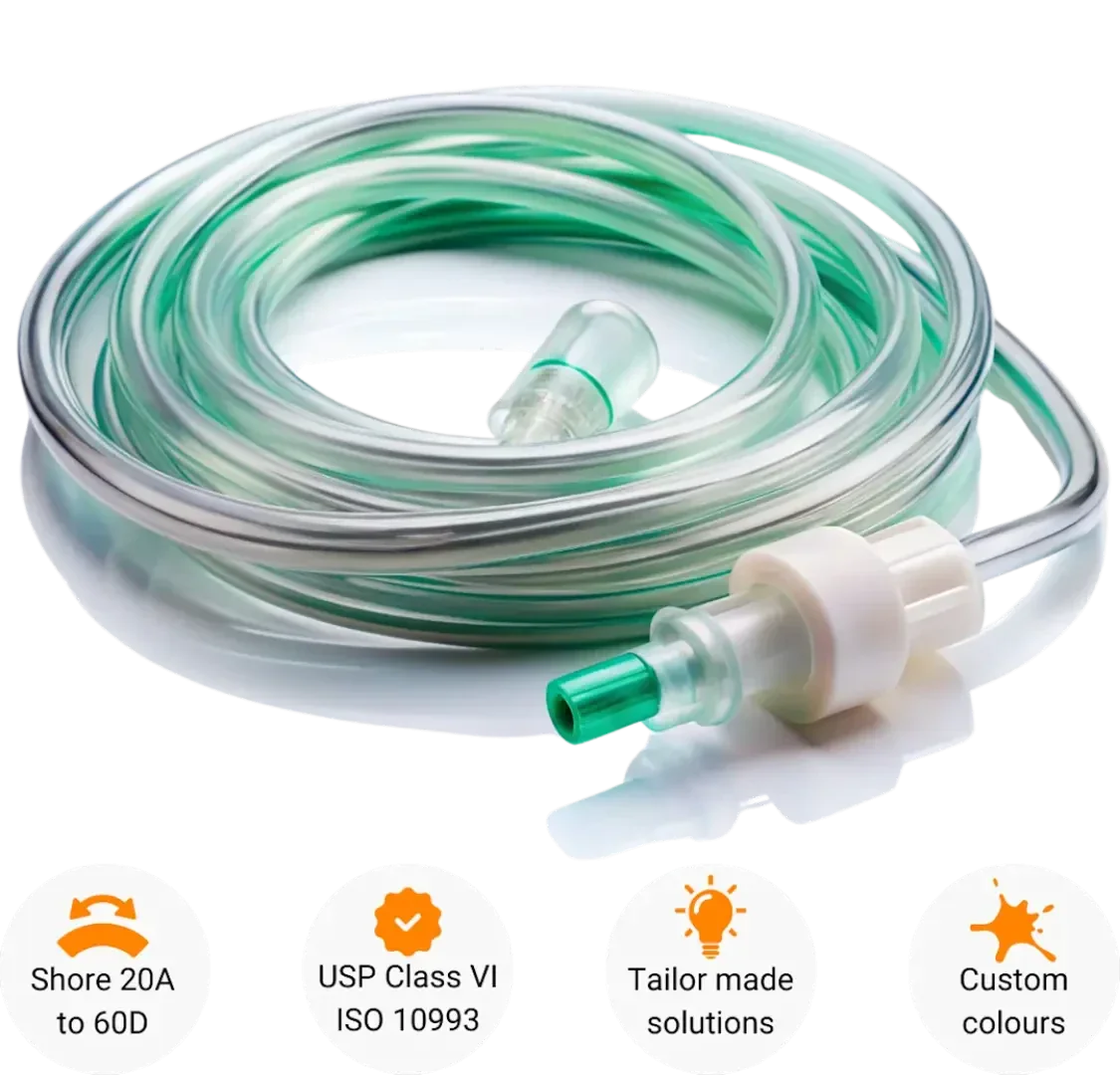 A coiled, transparent medical tube with green accents and a connector, shown at the top with symbols highlighting features: Shore 20A to 60D, USP Class VI ISO 10993, tailor-made solutions, and custom colors.
