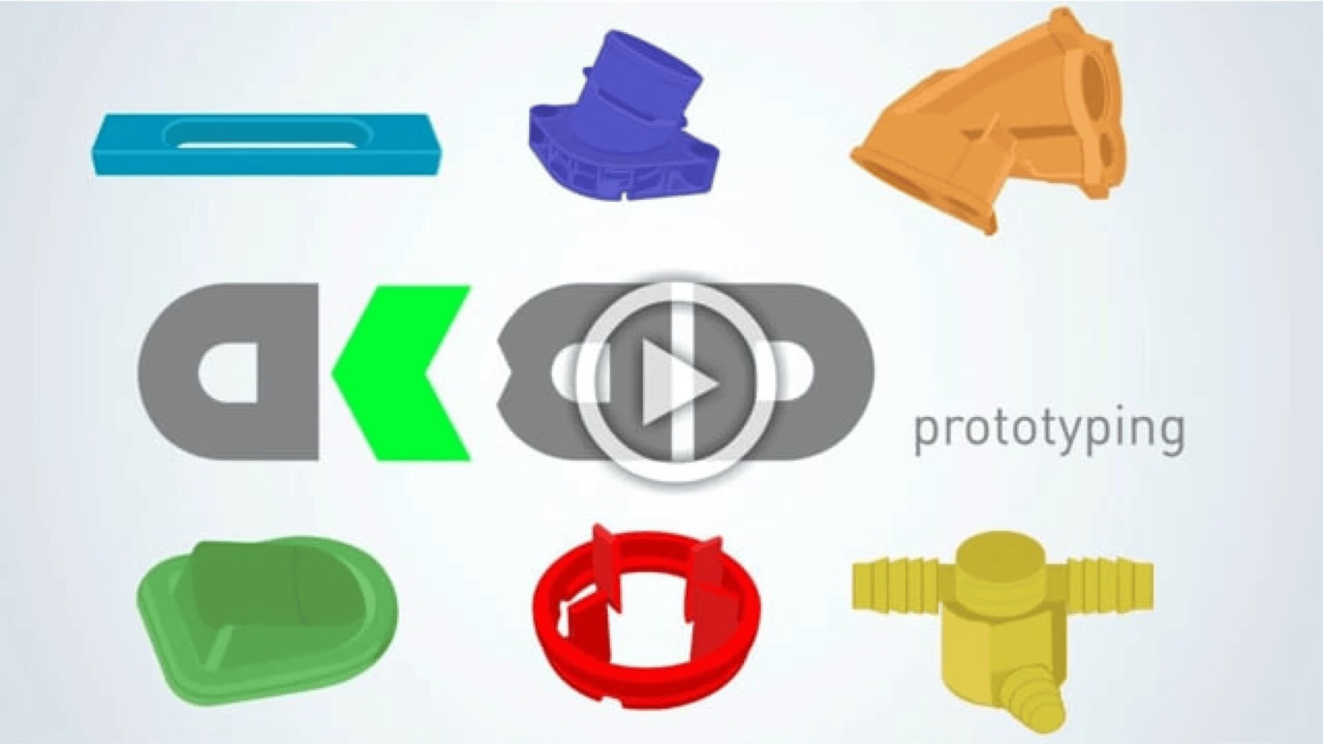 Bunte 3D-Prototypteile in verschiedenen Formen umgeben den Text „ak prototyping“ mit einem Play-Button-Symbol in der Mitte, was auf ein Video über Prototyping oder 3D-Modellierung hindeutet.