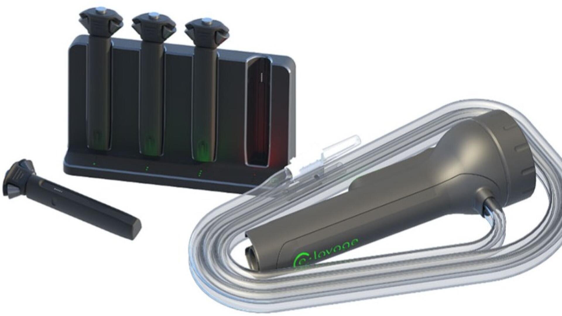 A medical device kit with a handheld device attached to a clear tube, three similar black devices in a charging station and an empty slot. The main device displays the word Levee with a green power symbol.