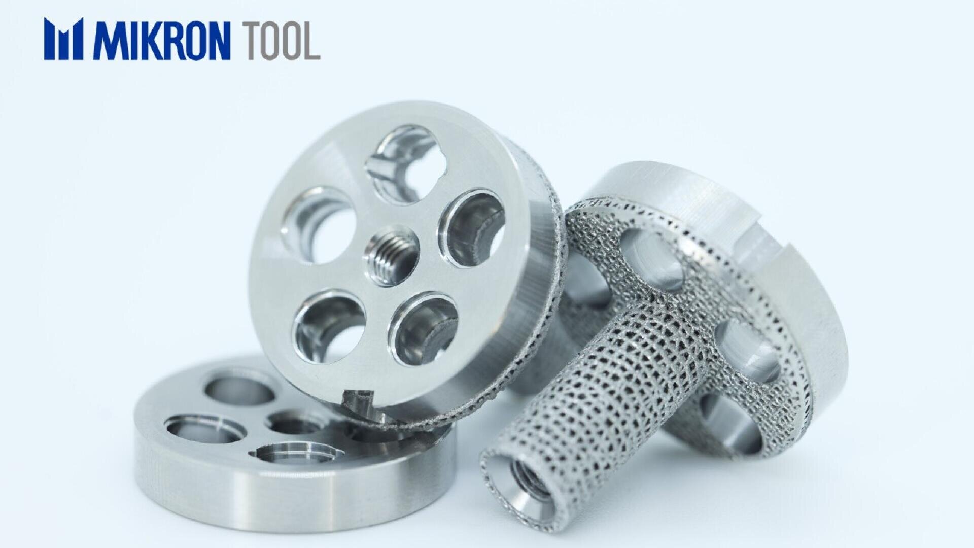 Three precision-machined metal components with multiple circular holes are displayed on a light background. The logo Mikron Tool appears in the top left corner.