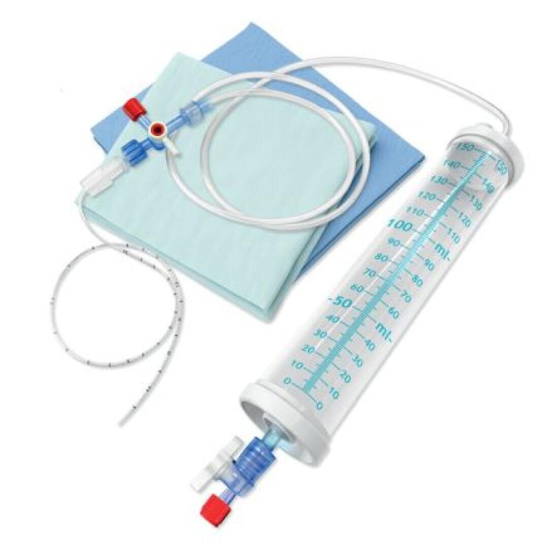 A medical drainage kit with a large graduated collection container, tubing, measuring lines and blue absorbent pads used to collect and measure body fluids.