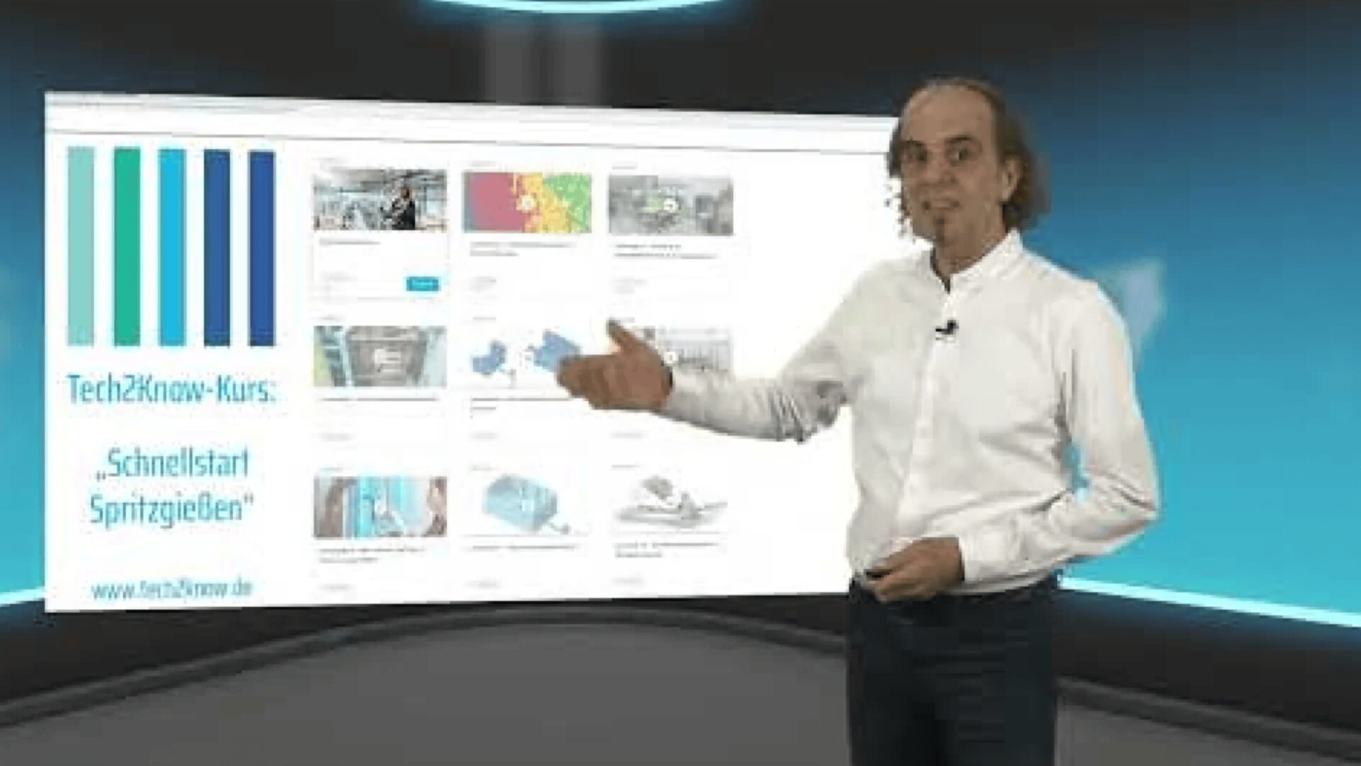 A man in a white shirt and jeans stands in front of a large digital screen displaying a website. He gestures toward the screen, which shows various images and text. The background is a modern, tech-themed studio.