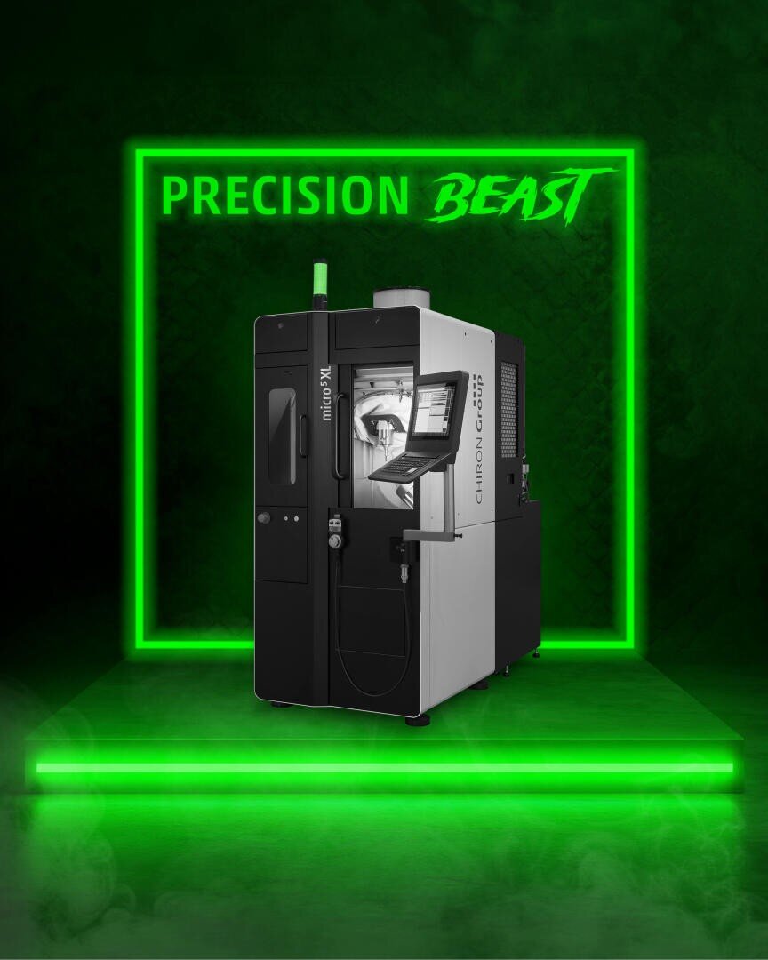 A sleek industrial machine stands under a neon green sign reading PRECISION BEAST, surrounded by green lighting and fog that emphasizes its modern and high-tech design.