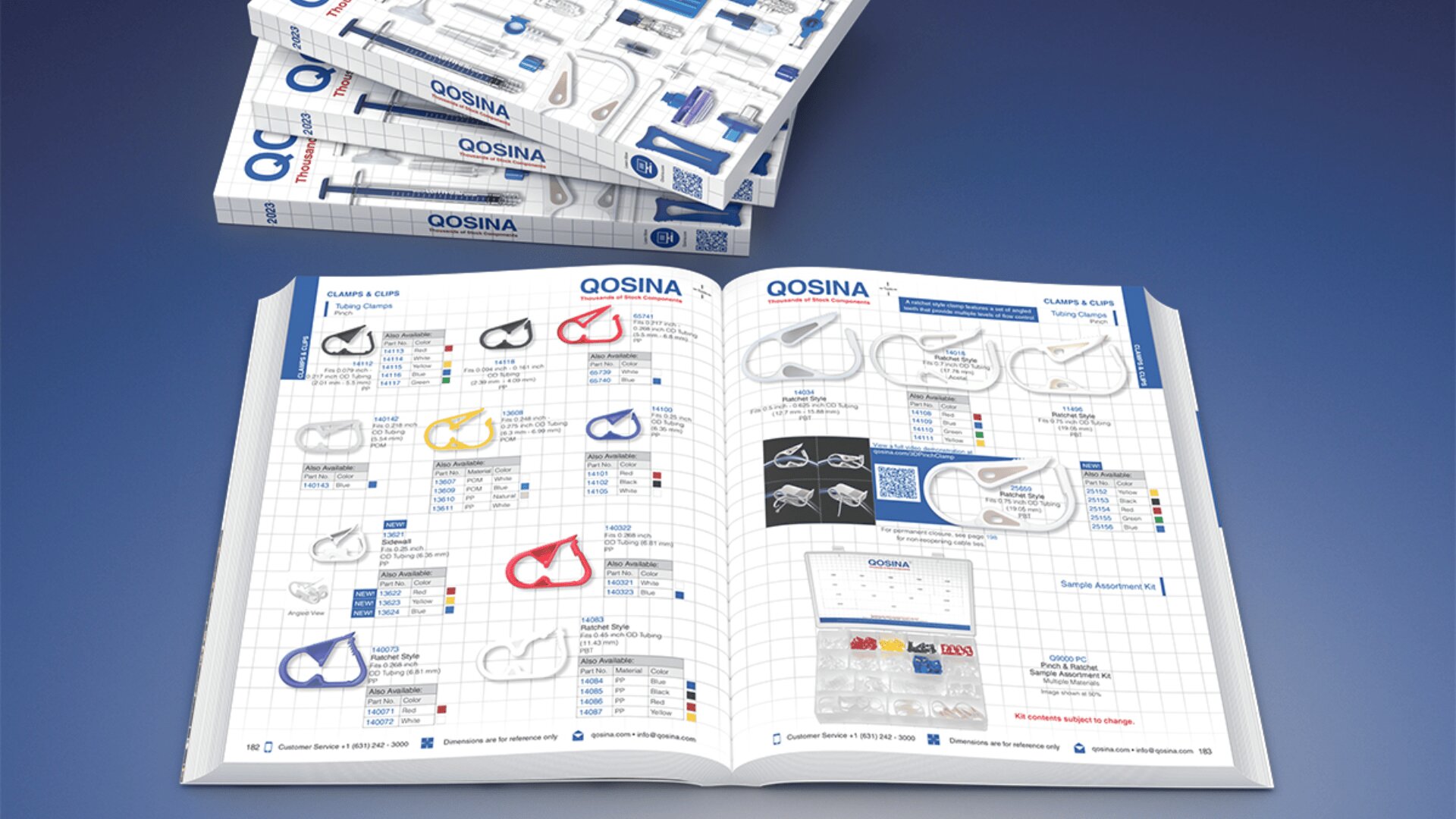 An open medical supplies catalog showing images and descriptions of various plastic clamps and clips, with additional closed copies of the catalog stacked on a blue surface in the background.