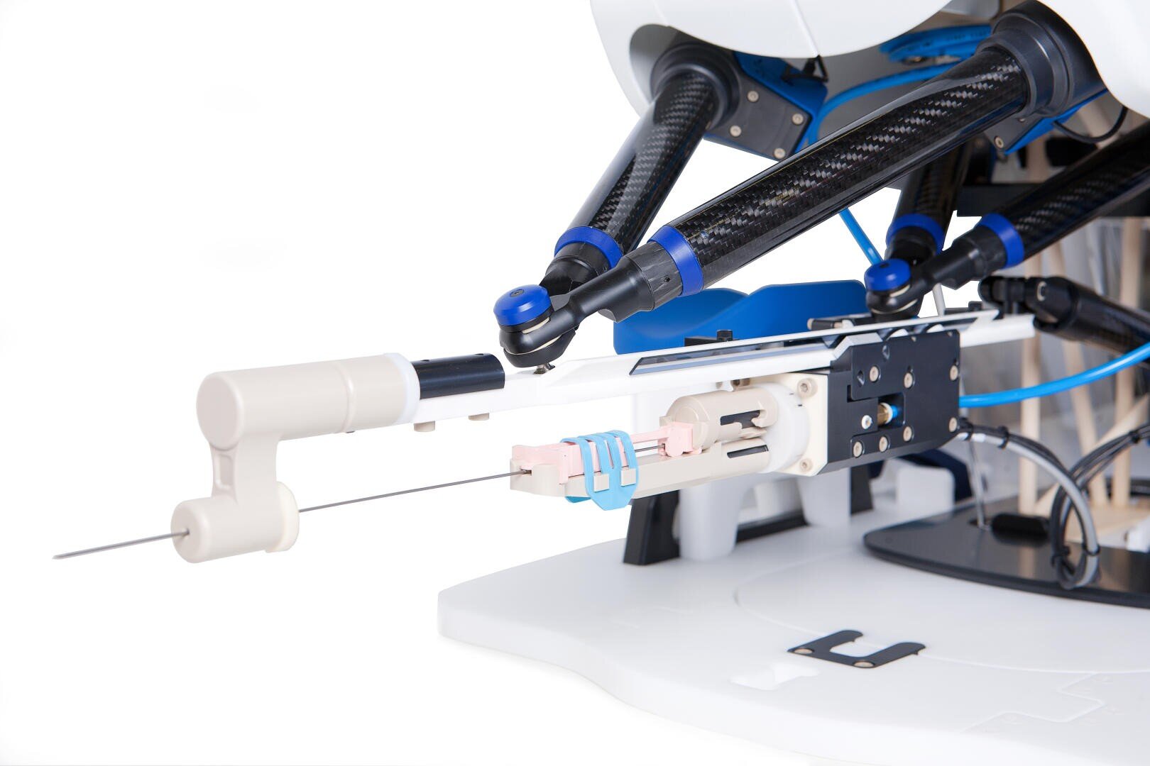 Close-up of a robotic surgical instrument with a long needle attachment, featuring metal arms, joints, and various blue and white components, designed for precise medical procedures.