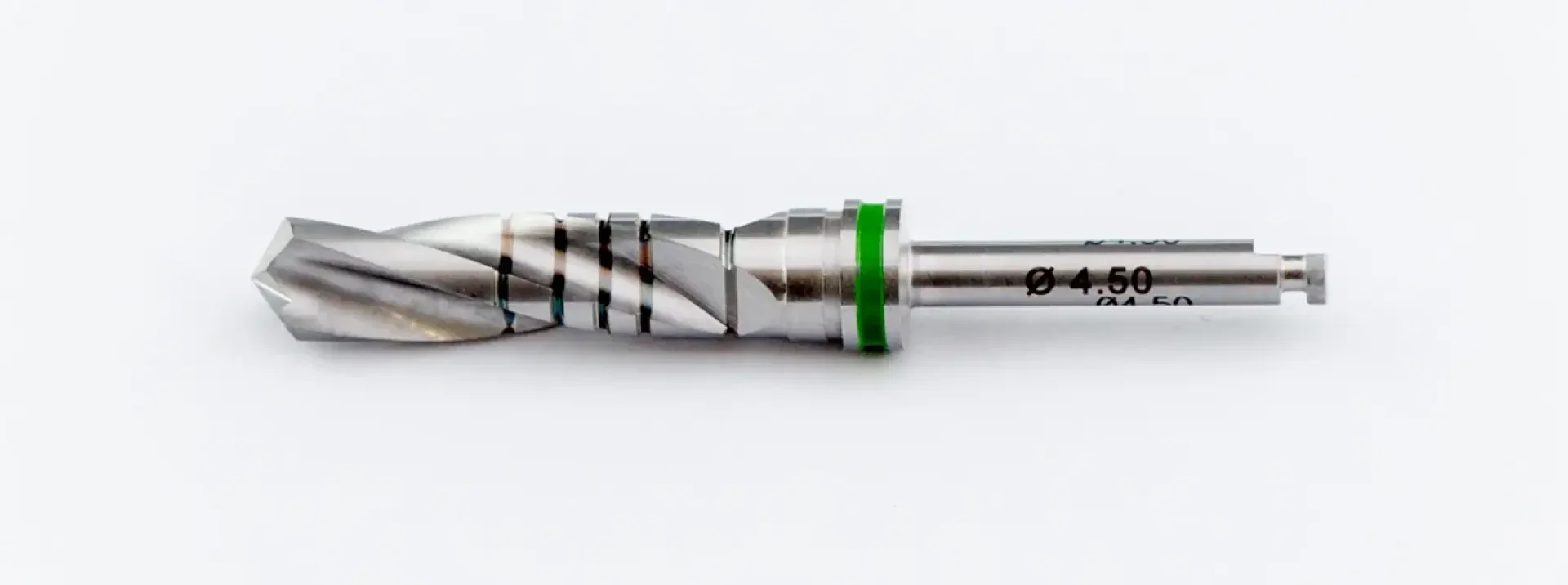 Close-up of a metal drill with spiral grooves and a green ring near the shank on a white background. The shank is provided with markings, including the diameter specification Ø 4.50.