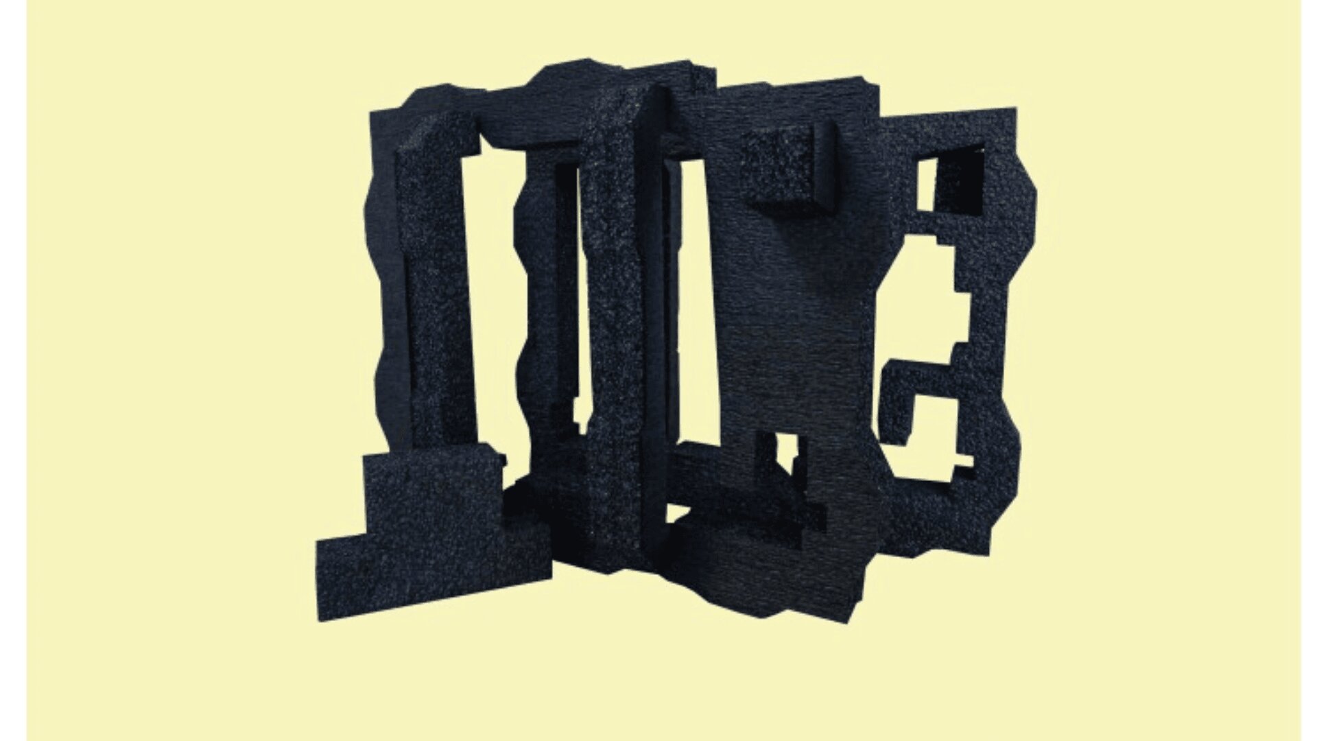 A black, abstract geometric sculpture with jagged edges and rectangular cutouts stands against a plain, pale yellow background.
