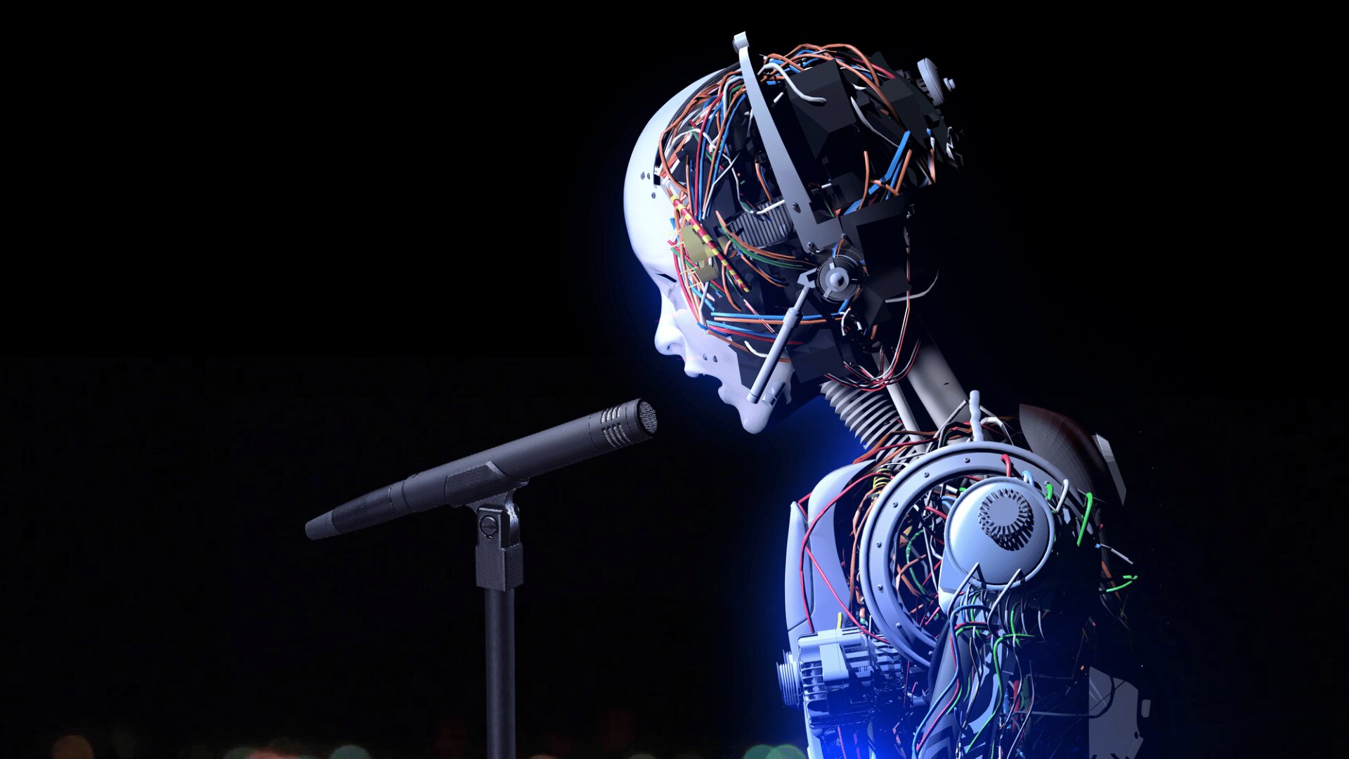 A humanoid robot with exposed wires and mechanical parts stands in profile, illuminated by blue light, speaking or singing into a microphone against a dark background.