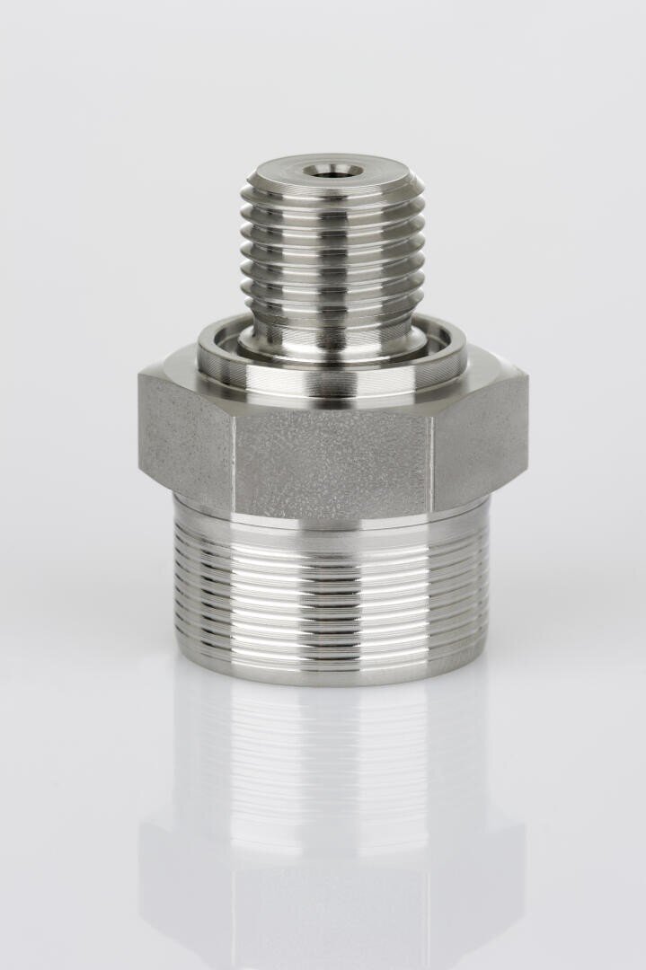 A close-up of a metal threaded pipe fitting adapter, shown upright on a plain white background. The fitting has both internal and external threads and a hexagonal center for tightening.