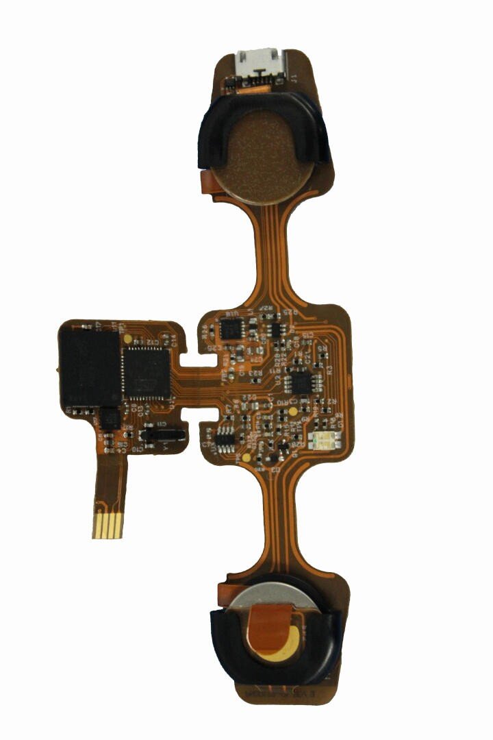 A close-up of an electronic circuit board with various components, flexible connectors, and microchips mounted on it, isolated on a white background.