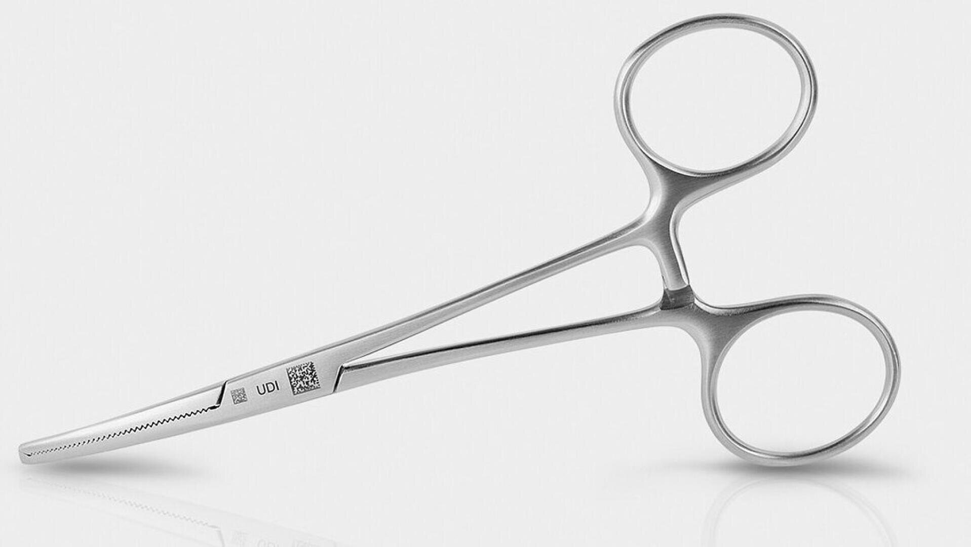 A stainless steel hemostat with curved, serrated jaws and finger rings, designed for surgical use, is shown against a white background.