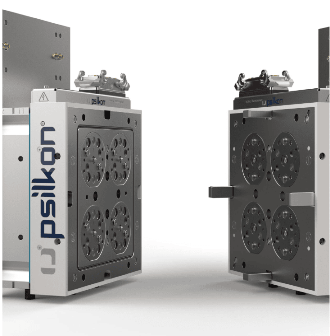 Zwei offene industrielle Metallformen stehen sich gegenüber, jede mit detaillierten kreisförmigen Mustern und Psilkon-Branding, vor einem schlichten weißen Hintergrund.