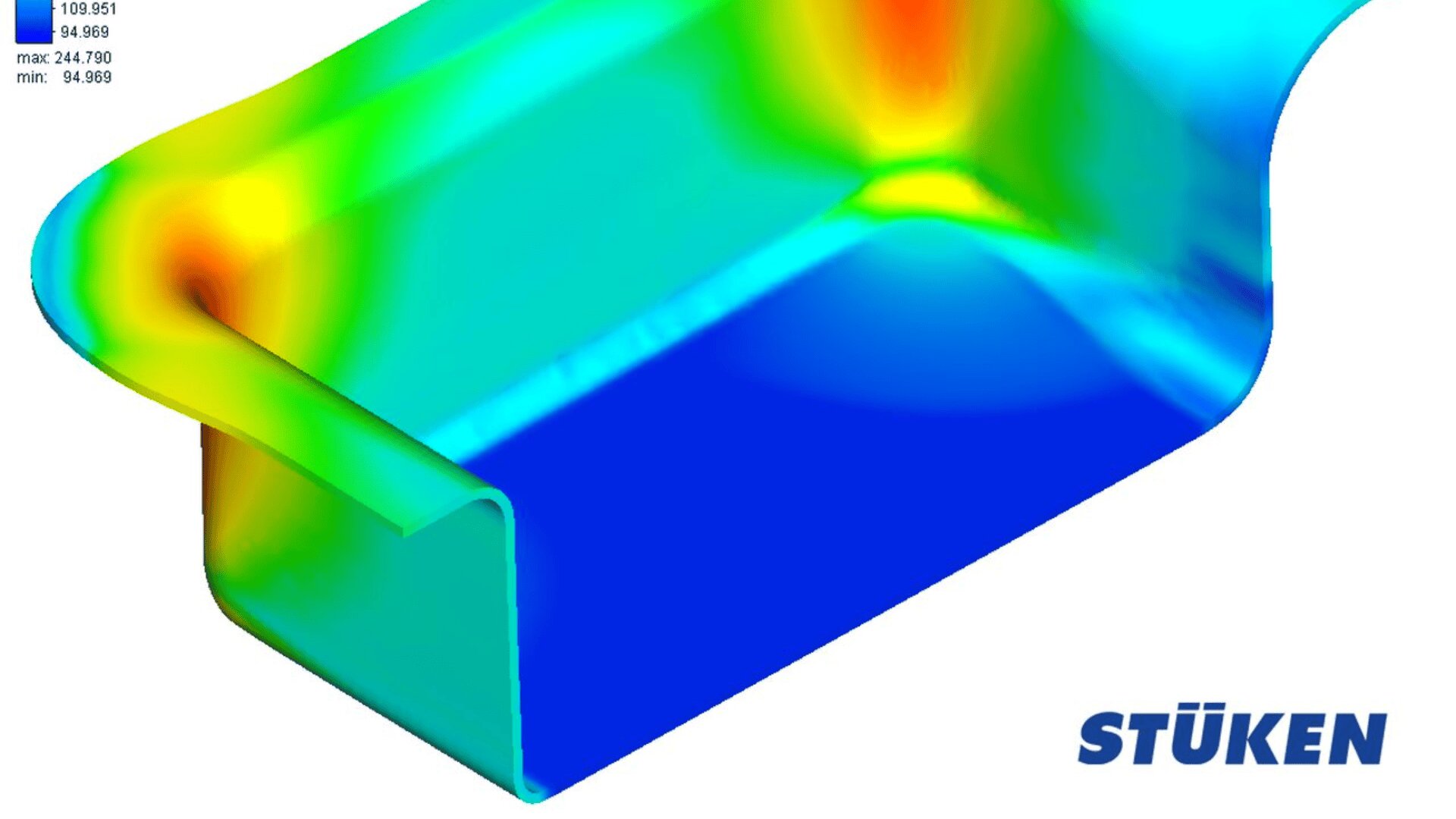 A computer-generated simulation of a rectangular metal part shows stress distribution in various colors, ranging from blue (low stress) to red (high stress). The STÜKEN logo appears in the bottom right corner.